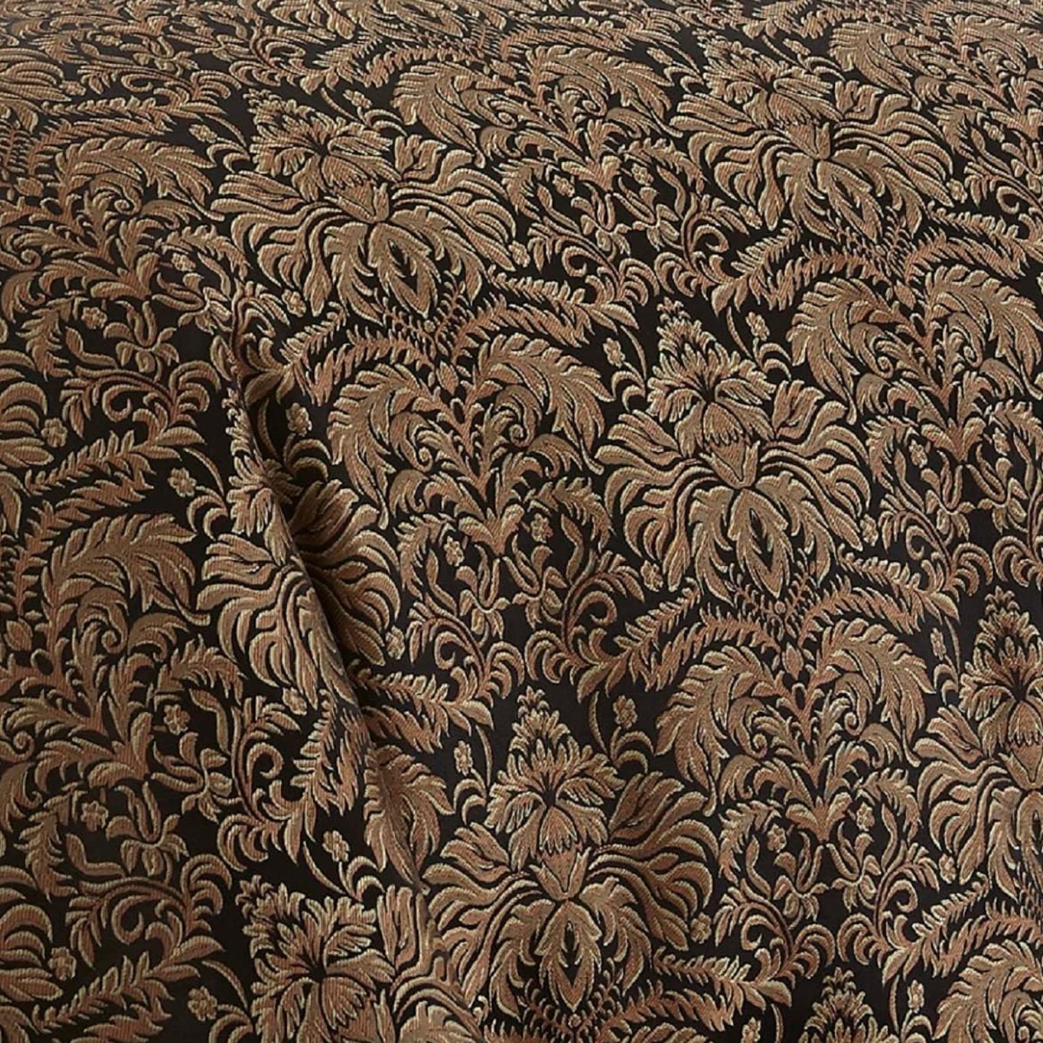 Best luxury bedding sheets — macro close-up of intricate imperial damask jacquard weave pattern in deep black and antique gold